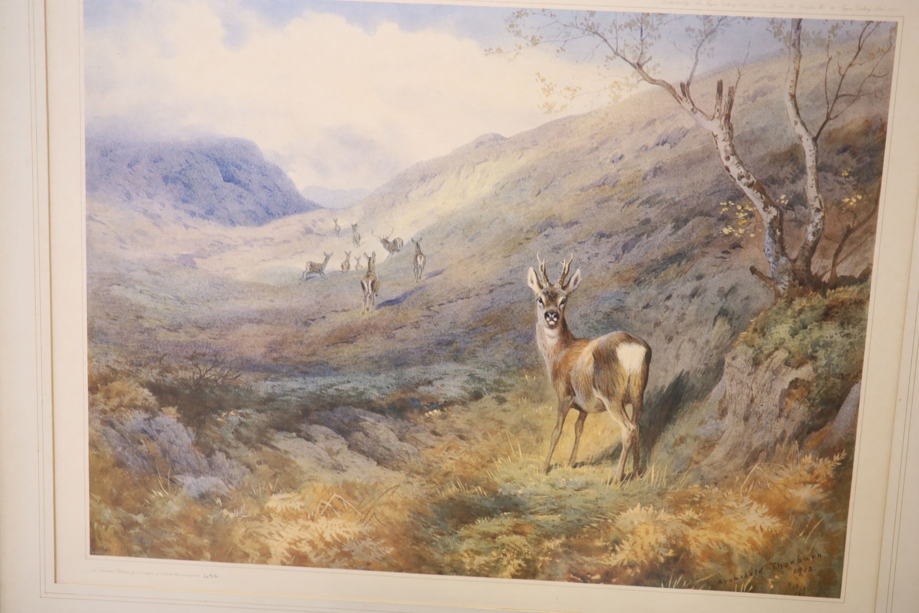 After Archibald Thorburn, Highland landscape with stag, numbered 456/500 and three other framed prints after Thorburn